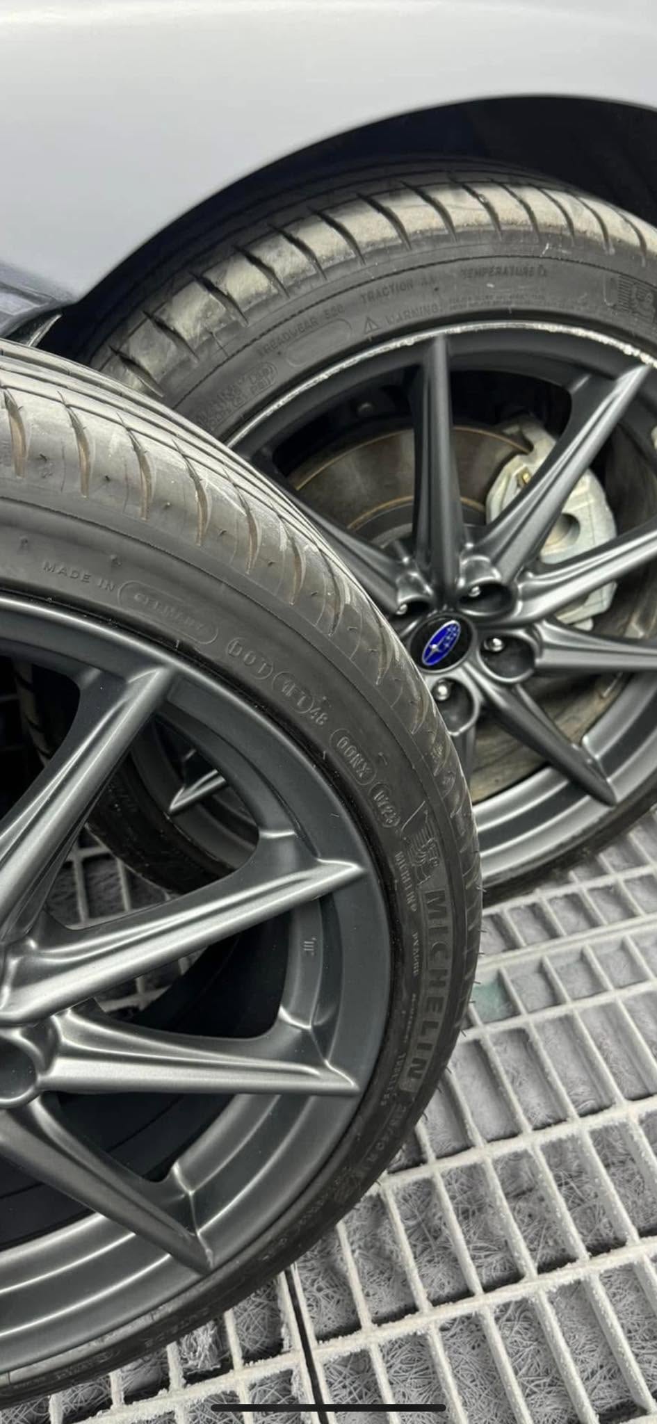 Pair of matte graphite alloy wheels fitted with tyres
